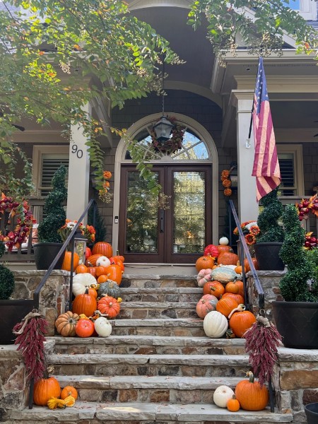 An inviting seasonal porch arrangement